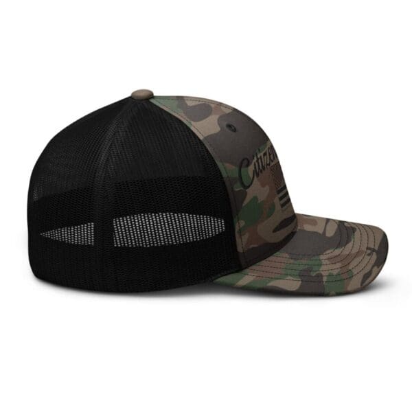 A Camouflage 1247 Snap Back Trucker Hat with Citizens Army & Flag (Black Font) that has an american flag on it.
