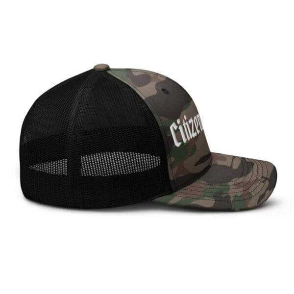 A camouflage 1247 Snap Back Trucker Hat w/Citizens Army (White Font) with the word citizen on it.