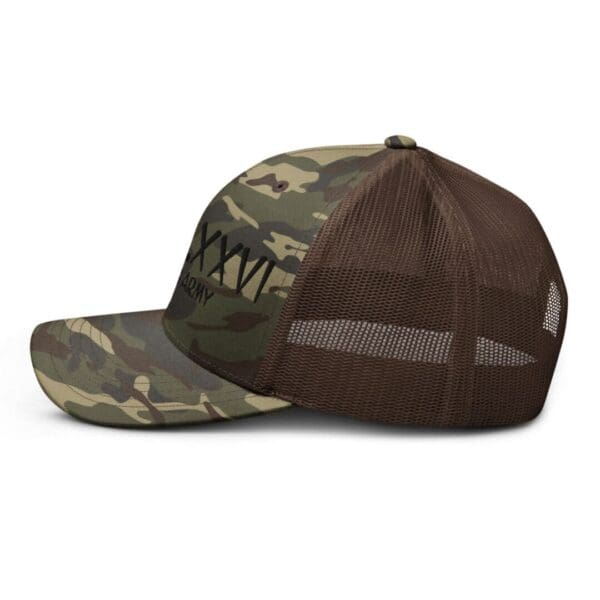 A Camouflage 1247 Snap Back Trucker Hat w/MDCCLXXVI (Black Font) with a black logo on it.