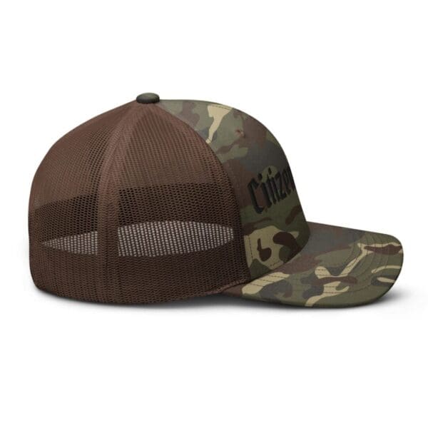 A Camouflage 1247 Snap Back Trucker Hat w/Citizens Army (Black Font) hat with the word chicago on it.