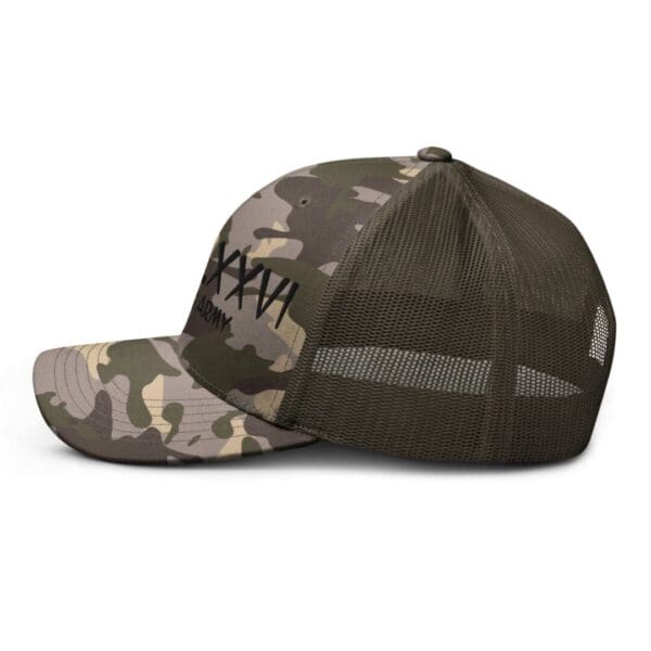 A Camouflage 1247 Snap Back Trucker Hat w/MDCCLXXVI (Black Font) with the word mkn on it.