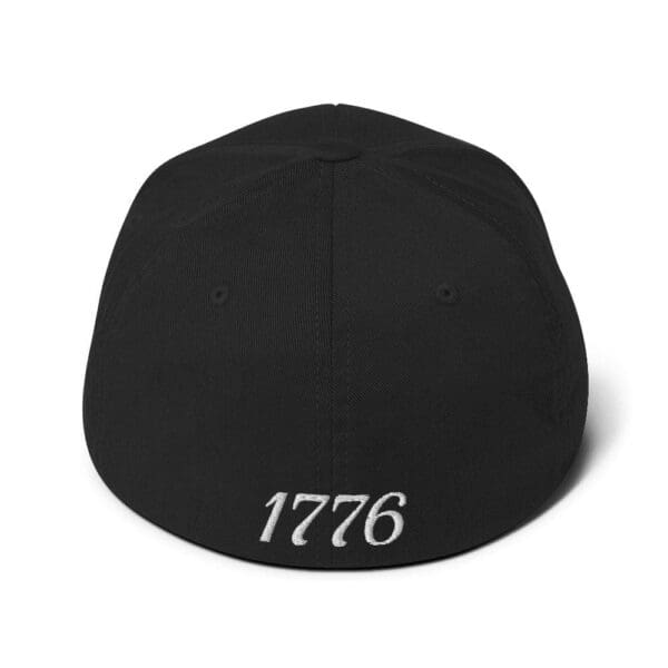 A 6277 Flexfit Cap Citizens Army w/ Flag (White Font) with the word 1776 on it.