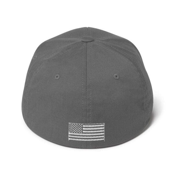 A gray 6277 Flexfit Cap w/ White Logo with an american flag on it.