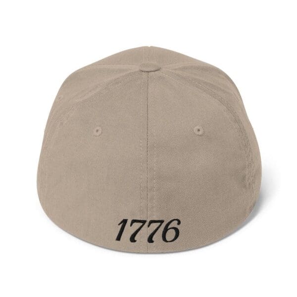 A black hat with the word 1776 on it.