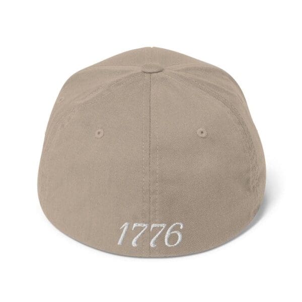 A 6277 Flexfit Cap Citizens Army w/ Flag (White Font) with the word 1776 on it.