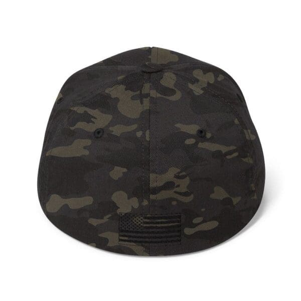 A 6277 Flexfit Cap w/ Black Logo with an american flag on the front.