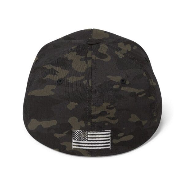 A black 6277 Flexfit Cap w/ White Logo with an american flag on it.