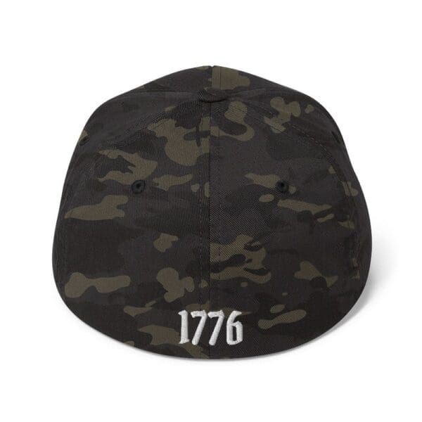 A black hat with the 6277 Flexfit Cap w/Citizens Army (White Font) on it.