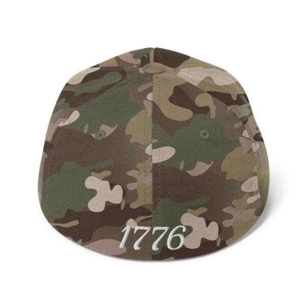 A 6277 Flexfit Cap Citizens Army w/ Flag (White Font) with the word 1776 on it.