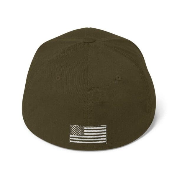 A brown 6277 Flexfit Cap w/ White Logo with an american flag on it.