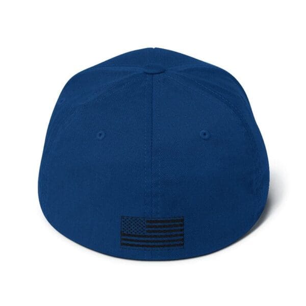 The back of a 6277 Flexfit Cap w/ Black Logo with an american flag on it.