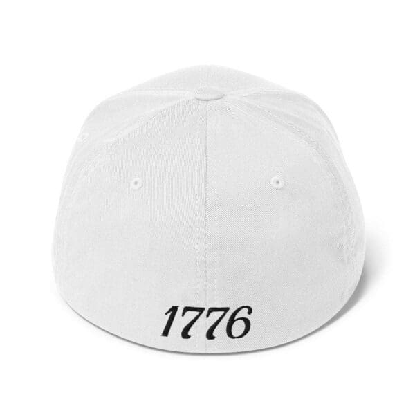 A white 6277 Flexfit Cap Citizens Army w/ Flag (Black Font) hat with the word 1776 on it.