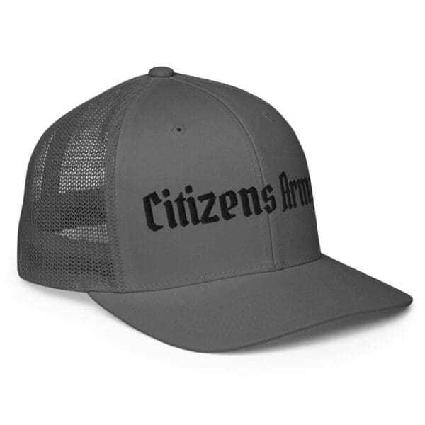 A 6511 Flexfit Trucker Cap w/Citizens Army (Black Font) with the word citizens army on it.