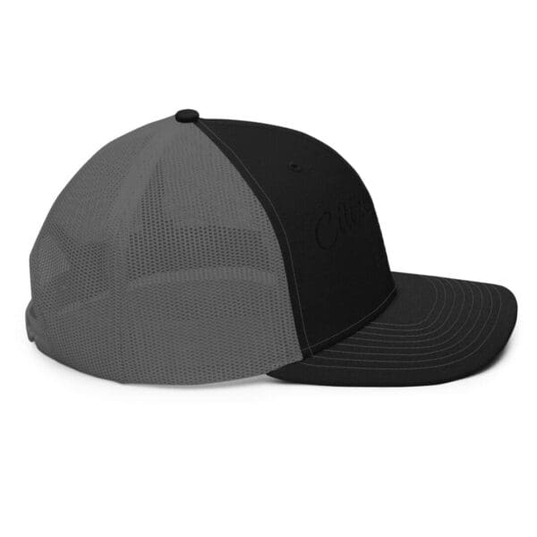 A black and grey 112 Snap Back Trucker Cap Citizens Army w/ Flag (Black Font).