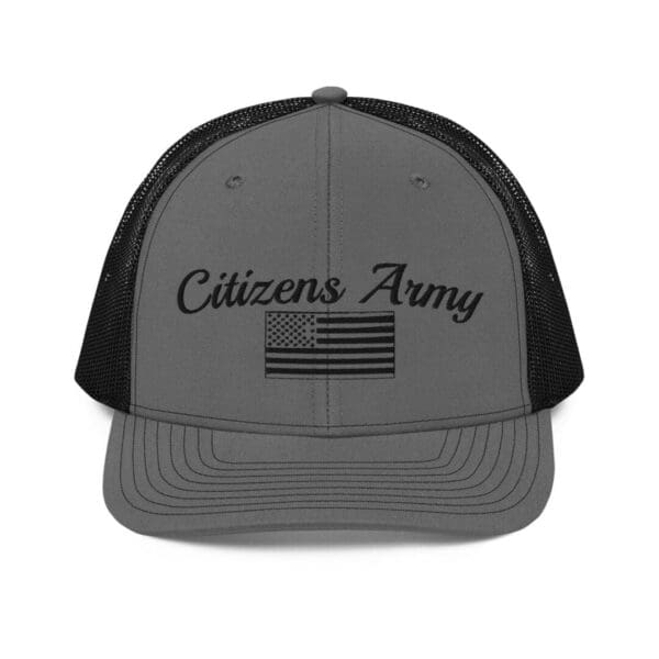 A grey hat with a 112 Snap Back Trucker Cap Citizens Army w/ Flag (Black Font) and black text.