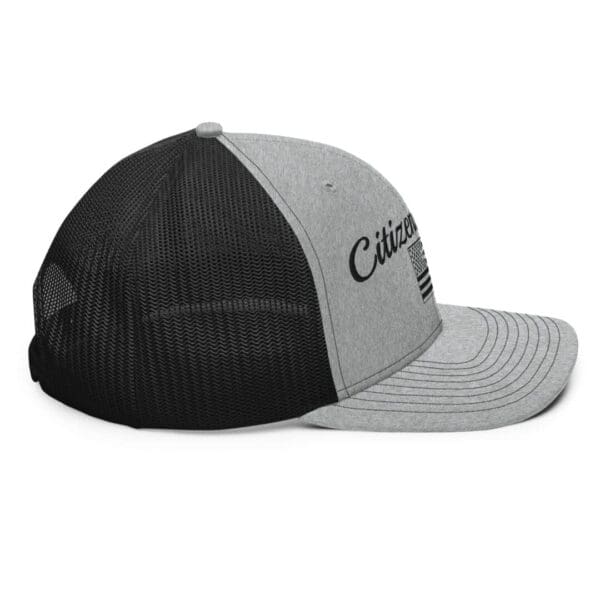 A grey and black 112 Snap Back Trucker Cap Citizens Army w/ Flag (Black Font) with the word california on it.